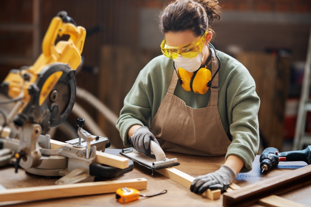 Young woman is training to be a carpenter