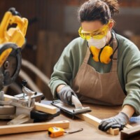 Young woman is training to be a carpenter