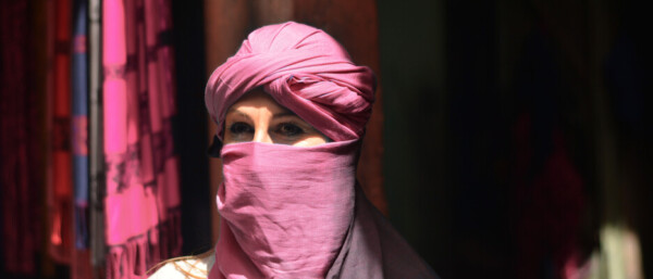Arabic lady outside market shop
