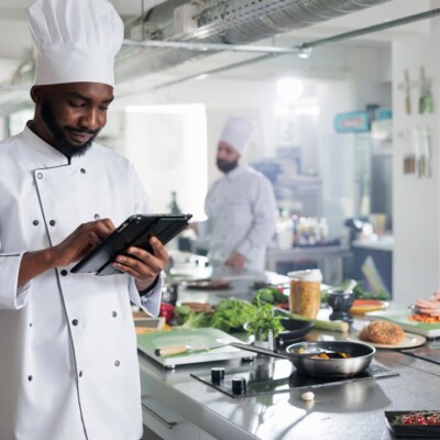 Head chef with touchscreen tablet