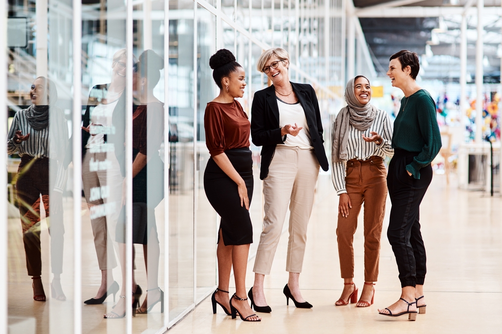 Diverse Group of Females Only in a modern Office