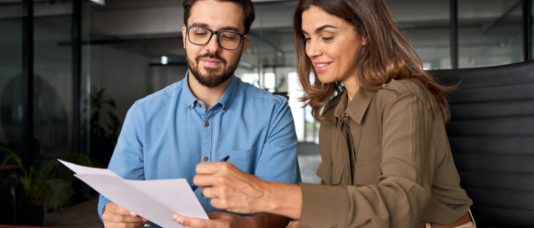 Smiling female and colleague work on HR duties